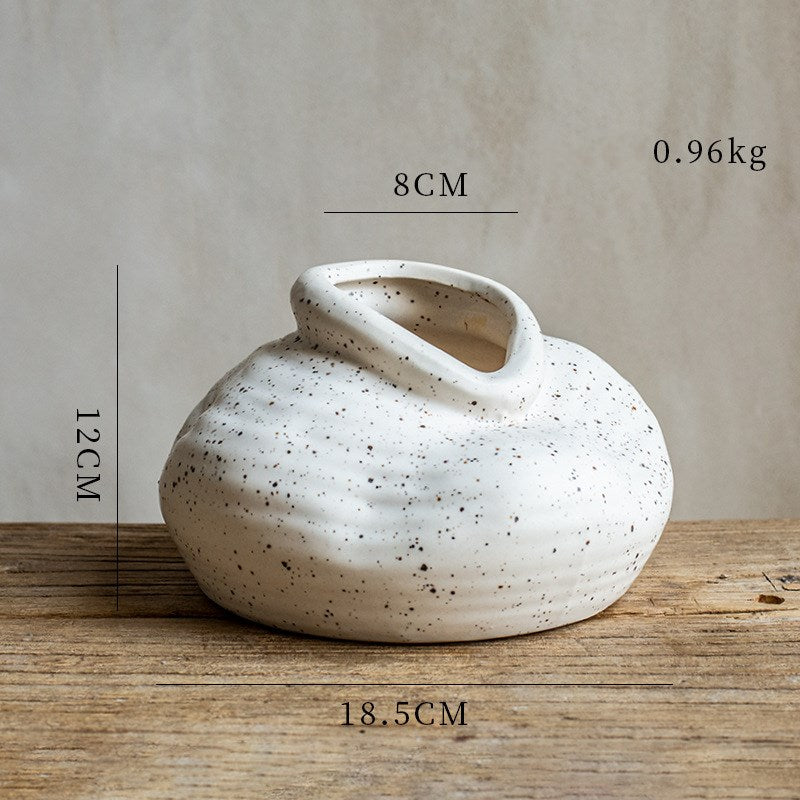 Speckled Pebble Vase, off-white stoneware with organic low-profile form and angled opening
