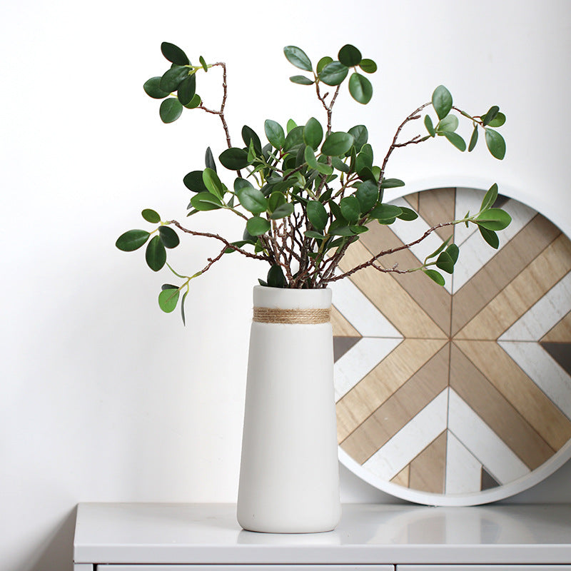 Minimal Rope Accent Vase, matte white ceramic with tapered silhouette and natural jute band detail holding leafy green stems