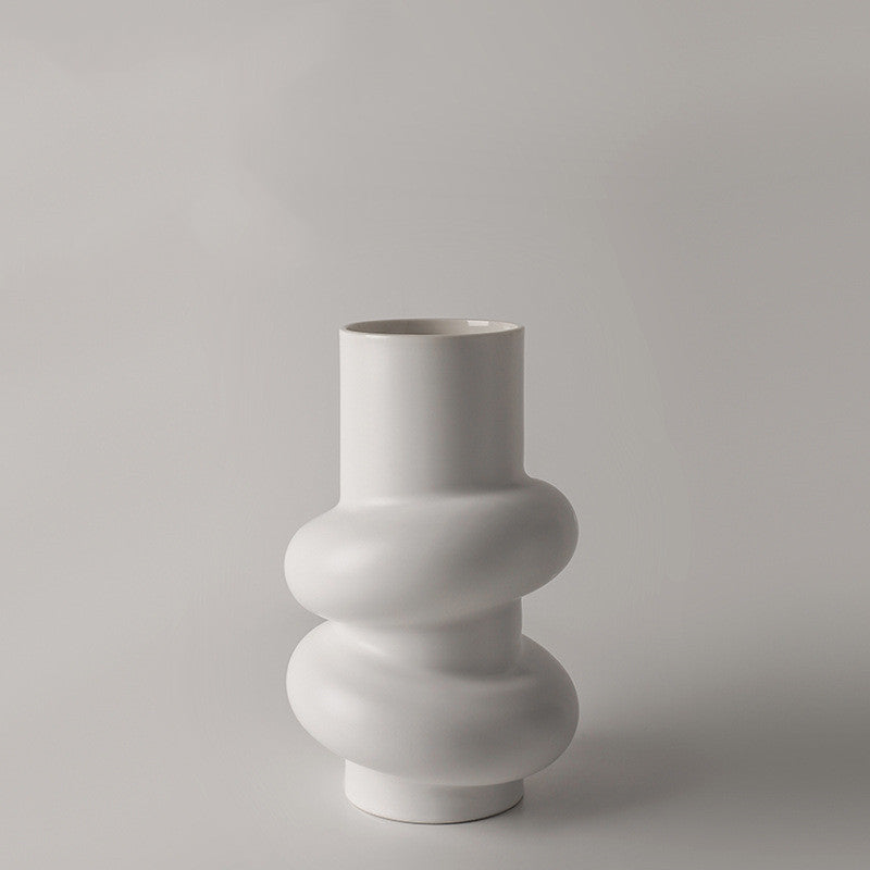 Sculptural Twist Vase, matte white ceramic with elongated neck and wrapped curved form