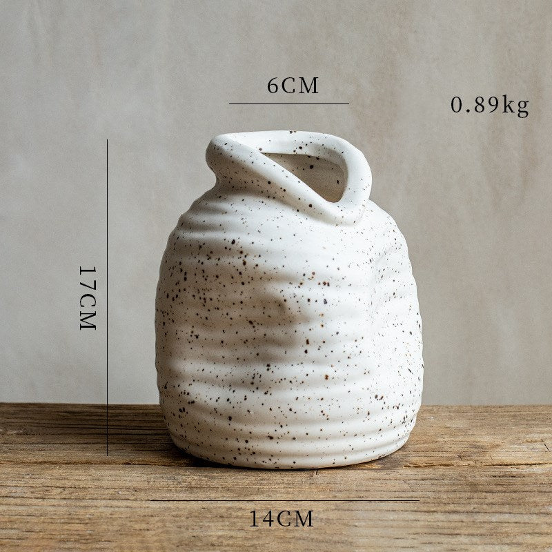 Speckled Bottle Vase, textured off-white stoneware with ribbed surface and angled opening