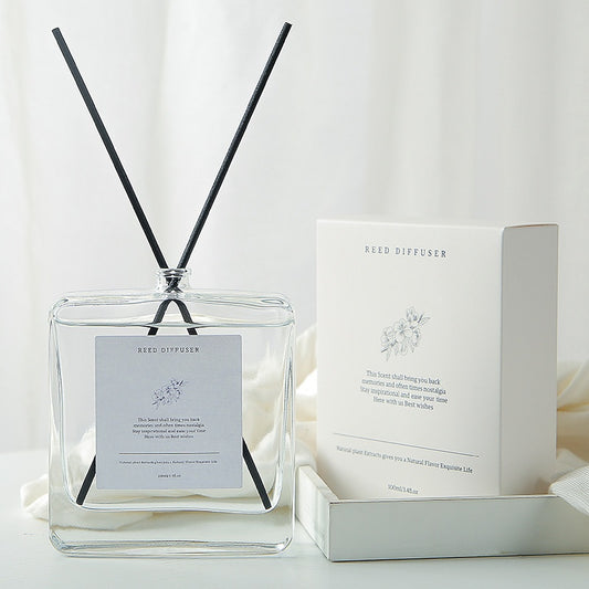 Minimalist Glass Reed Diffuser Set, clear square bottle with black reed sticks and elegant white packaging for fresh home fragrance