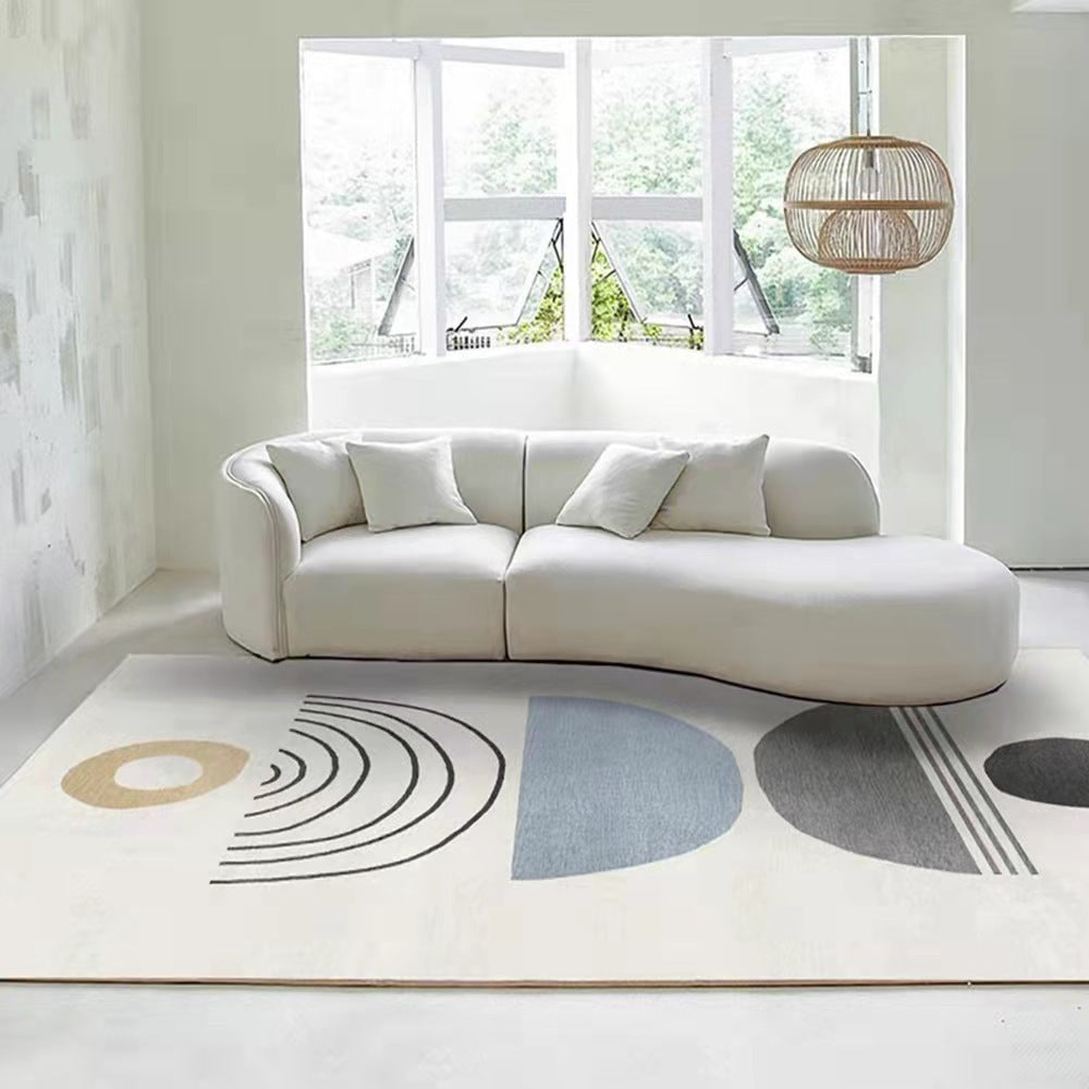 Modern Geometric Area Rug, cream woven textile with abstract shapes in black lines, gray, and muted blue tones