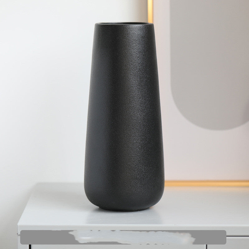 Minimal Tapered Vase, matte black ceramic with smooth elongated silhouette