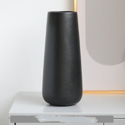 Minimal Tapered Vase, matte black ceramic with smooth elongated silhouette