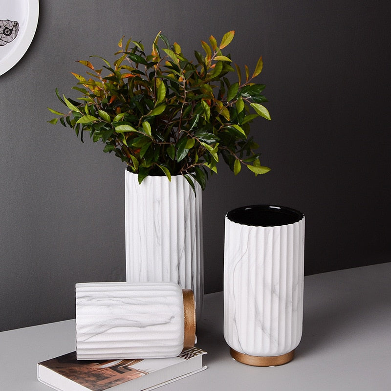 Fluted Marble Vase Set, white marble with vertical ribbed texture and warm wood base accents