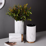 Fluted Marble Vase Set, white marble with vertical ribbed texture and warm wood base accents