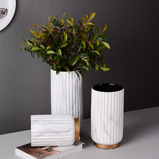 Fluted Marble Vase Set, white marble with vertical ribbed texture and warm wood base accents