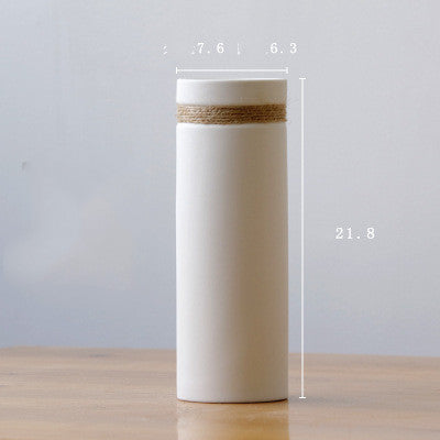 Slim Rope Accent Vase, matte white ceramic with tall cylindrical form and natural jute band detail