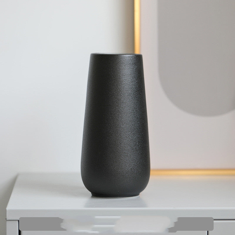 Minimal Tapered Vase, matte black ceramic with smooth rounded silhouette