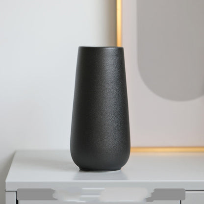 Minimal Tapered Vase, matte black ceramic with smooth rounded silhouette