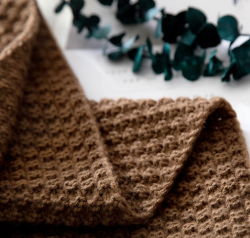 Textured Knit Throw Blanket, soft waffle weave fabric in warm brown tone for cozy and breathable comfort