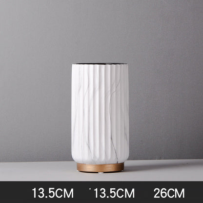 Medium Fluted Marble Vase, white marble with vertical ribbed texture and cylindrical form on wood base