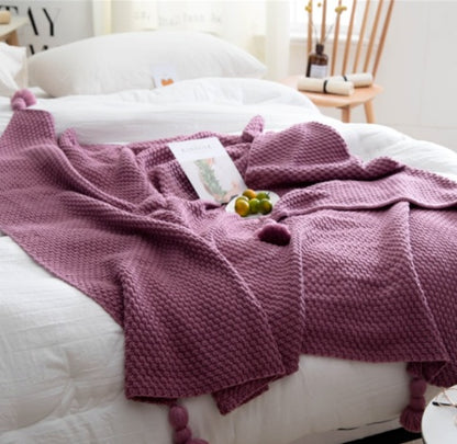 Textured Knit Throw Blanket with Tassels, soft waffle weave fabric in dusty rose tone for cozy and decorative comfort
