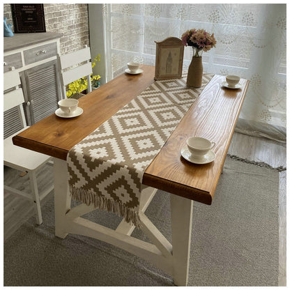 Geometric Diamond Table Runner, beige woven fabric with cream diamond pattern and tasseled edges