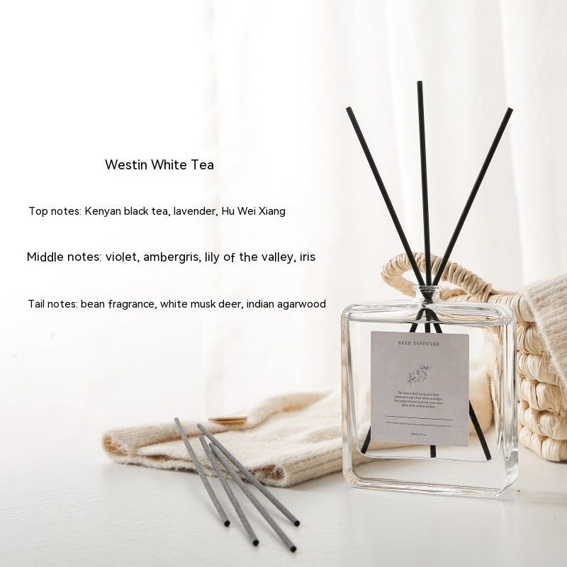 Luxury Glass Reed Diffuser, clear square bottle with black reed sticks and white tea fragrance for a fresh, calming and long-lasting home scent