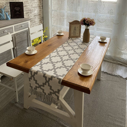 Geometric Pattern Table Runner, cream woven fabric with gray trellis design and tasseled edges