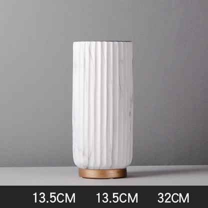 Tall Fluted Marble Vase, white marble with vertical ribbed texture and cylindrical form on wood base