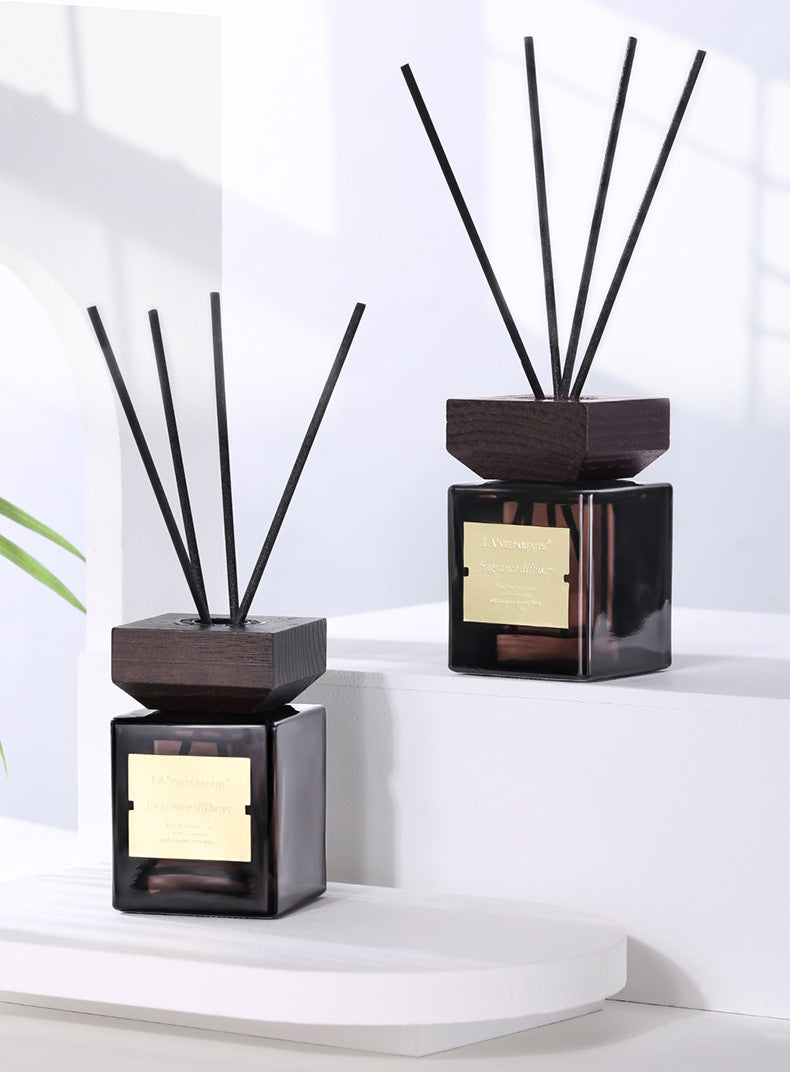 Luxury Reed Diffuser Set, amber glass fragrance bottles with wooden caps and elegant black reed sticks for long-lasting aromatherapy