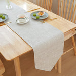 Textured Linen Table Runner, light beige woven fabric with subtle crosshatch pattern and soft drape