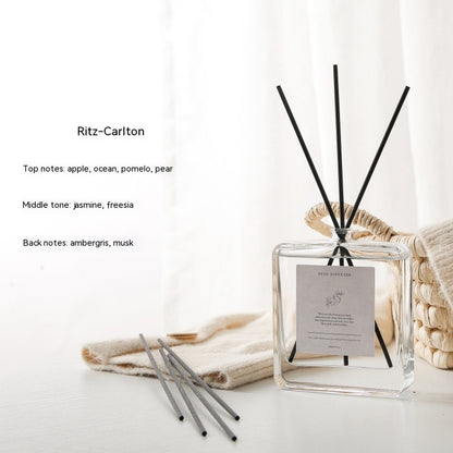 Luxury Glass Reed Diffuser, clear square aromatherapy bottle with black reed sticks and layered fragrance notes for elegant home ambiance