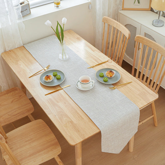 Textured Linen Table Runner, light gray woven fabric with clean rectangular silhouette styled on wooden dining table